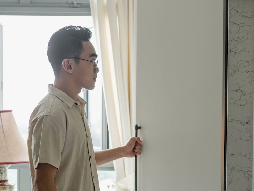Jerry, Salt Studio’s co-founder, opens a full-height cabinet in a home Salt designed