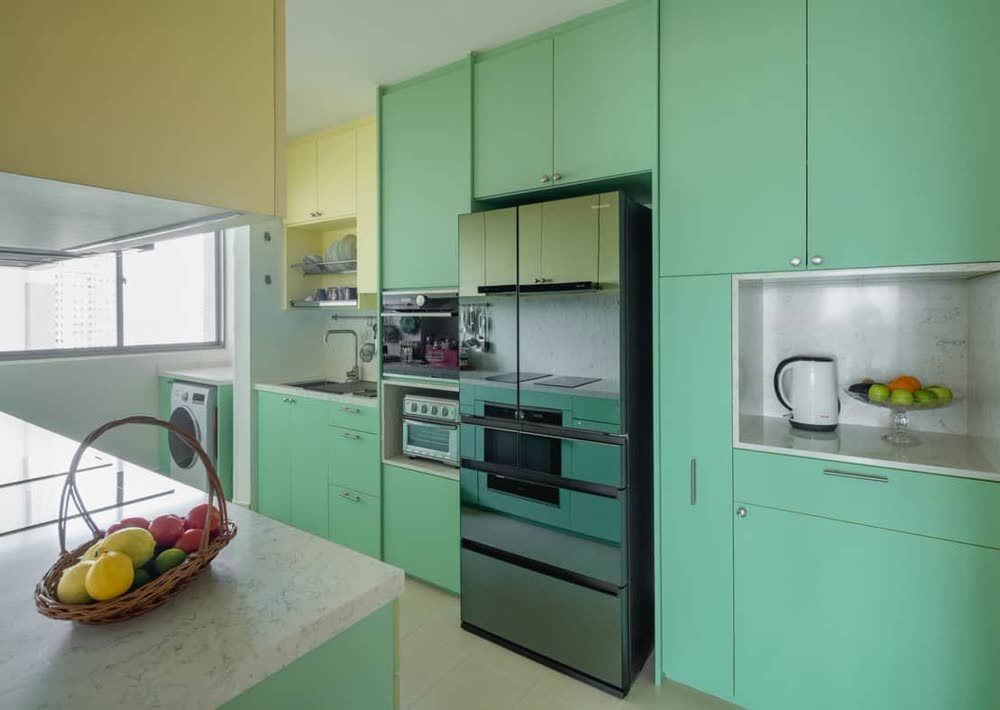 A mint-green kitchen in a 5-room BTO at Margaret Drive